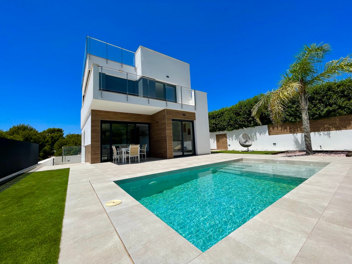 modern new built villa in la nucia 4 bedrooms and 2 living rooms terraces garden and private pool.
